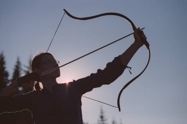 istock Archer shooting with a bow in the mountains. 695331636