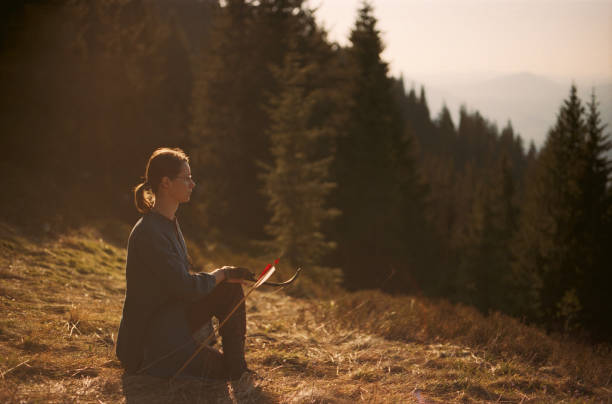 istock Archer shooting with a bow in the mountains. 695331920