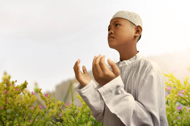 istock Asian muslim kid praying 695332226