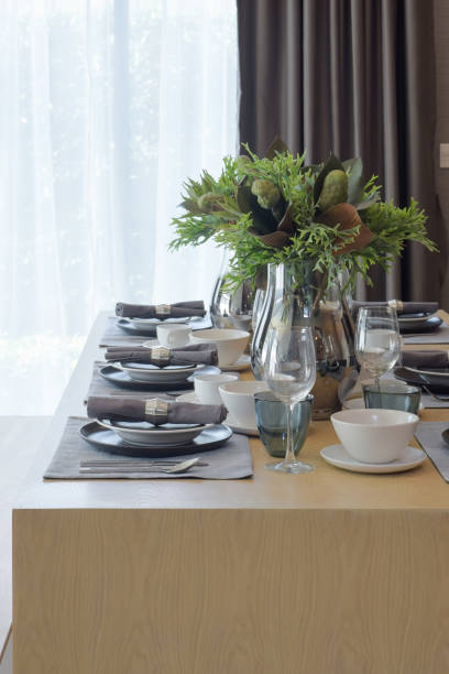 istock Modern classic style dining set in white and gray color scheme on wooden table 695332228