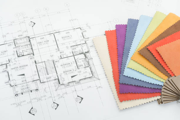 istock Close up sample of fabric and architectural drawing paper 695332258