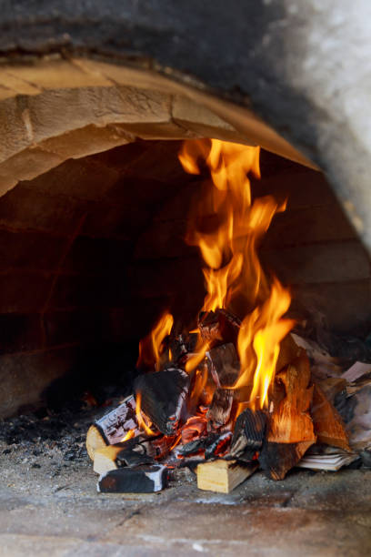 istock Pizzas baking in an open firewood oven 695334674