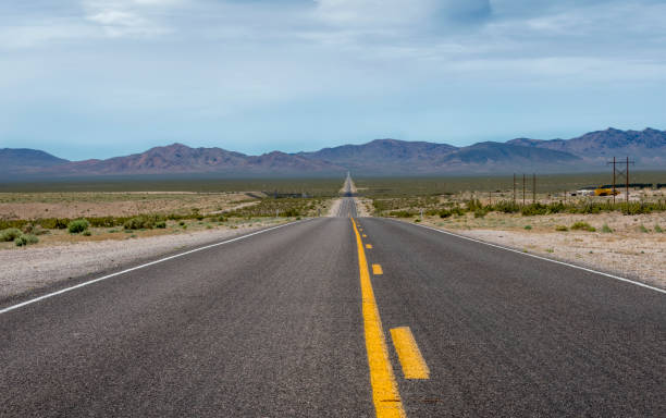 istock road landscape with a big long road with yellow middle lines 695338176