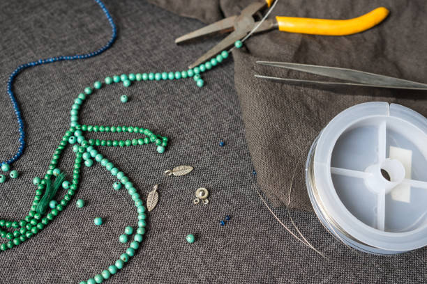 istock Selective Focus of DIY Tools,  Bracelet and Necklace Accessories from Stone Beads 695349990