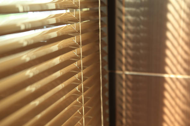 istock blinds in home with sunlight on the window 695350570