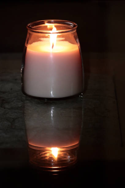 istock Candle in the Storm 695350870
