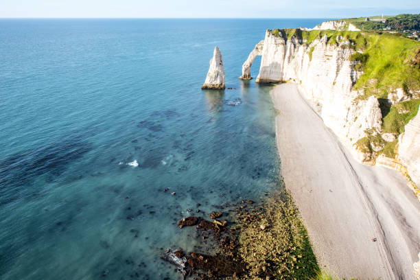 istock Landscape view on the rocky coastline in Etretat 695353348