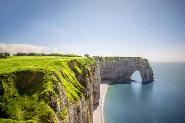 istock Landscape view on the rocky coastline in Etretat 695353810