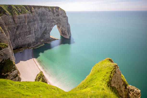 istock Landscape view on the rocky coastline in Etretat 695353868