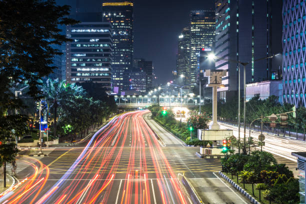 istock Traffic light trails on Jakarta main avenue in Indonesia 695354566