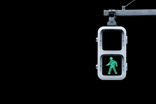 Japanese pedestrian signal isolated on Black.
