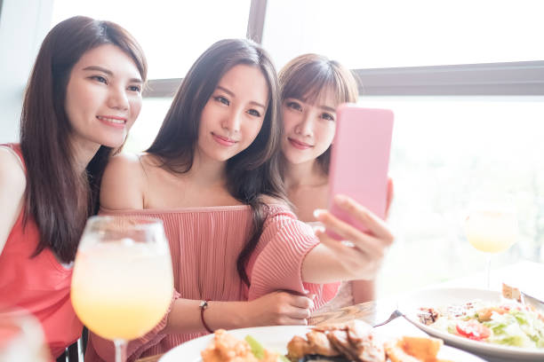 istock woman dine in restaurant 695358610
