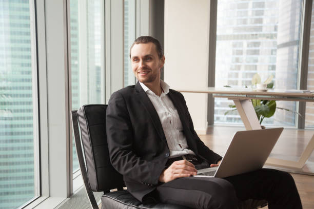 istock Entrepreneur dreaming about happy future in office 695358944