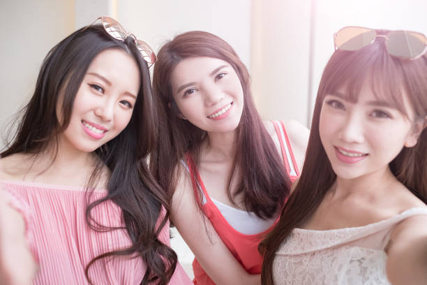 istock women selfie in mall 695361410