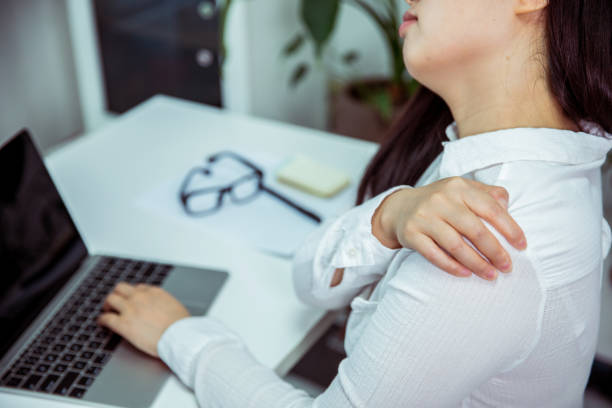 istock Businesswoman has shoulder pain 695372136