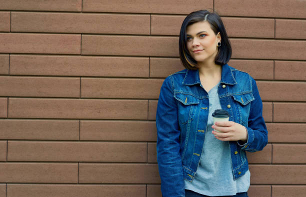 istock young woman  with a cup of coffee 695372312