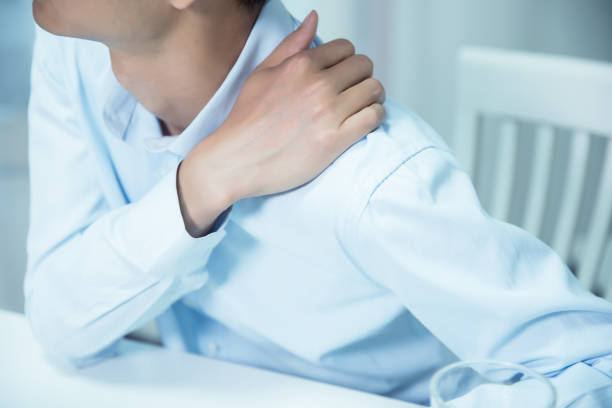 istock Businessman shoulder pain 695372884