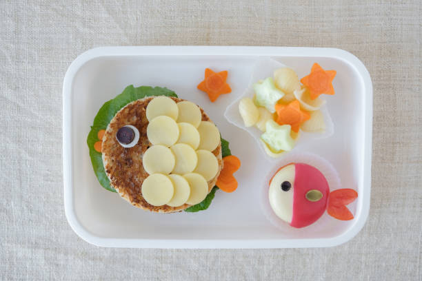 istock Fish lunch box, fun food art for kids 695379774