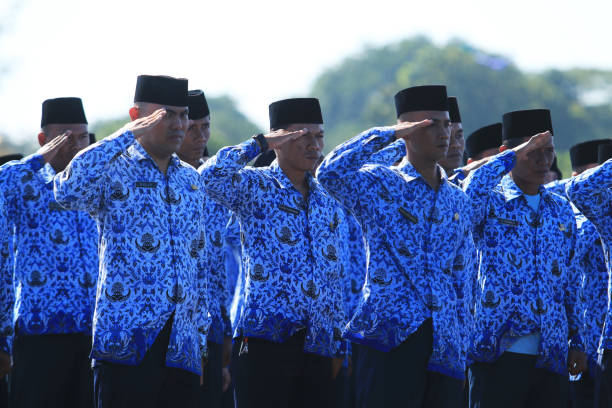 The flag ceremony commemorating the 71th anniversary of the Air Force. Jakarta-Indonesia, civil servants within the TNI AU attend the flag ceremony to commemorate the 71th anniversary of the Air Force. civil servant stock pictures, royalty-free photos & images