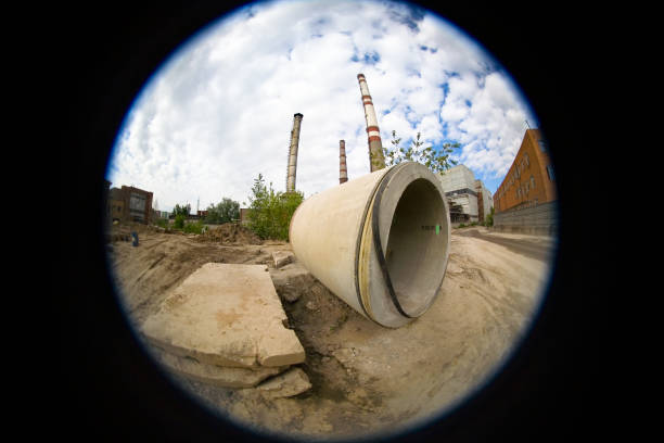 istock Industrial landscape with pipes and concrete slabs. 695390234