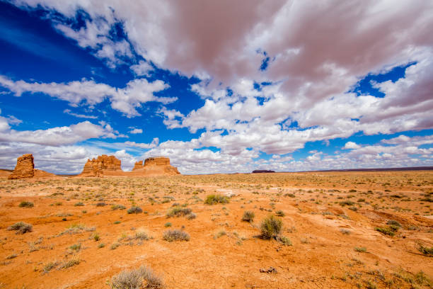 istock Distant view of navajo sandstone against sky 695397800