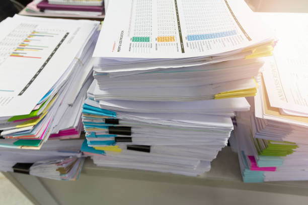 istock Pile of unfinished documents on office desk, Stack of business paper 695398366