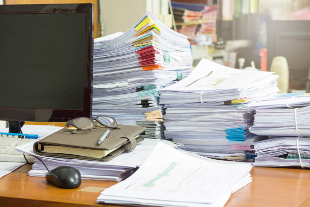 istock Pile of unfinished documents on office desk, Stack of business paper 695398382