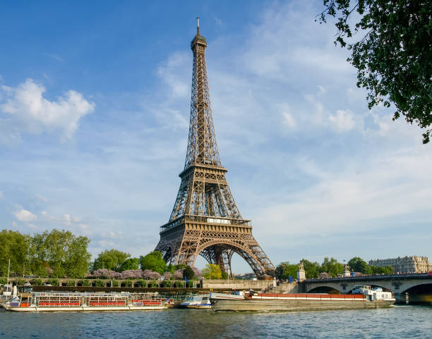 istock Eiffel Tower with river on the foreground in Paris 695406926