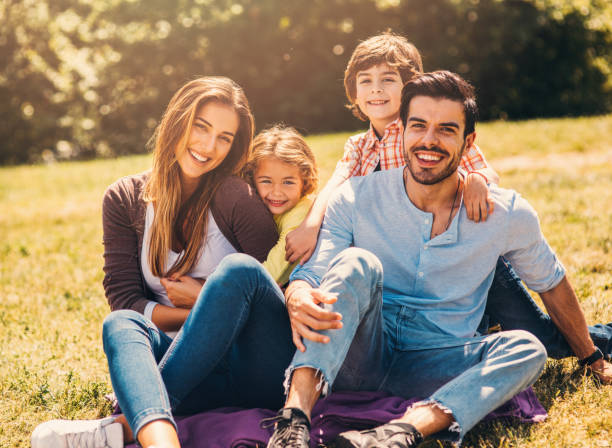 istock Young family in the park 695408206