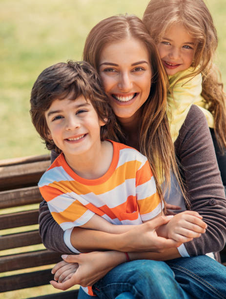 istock Mother with her children 695408224