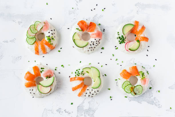 istock Sushi donuts set on white background. Flat lay, top view 695411568