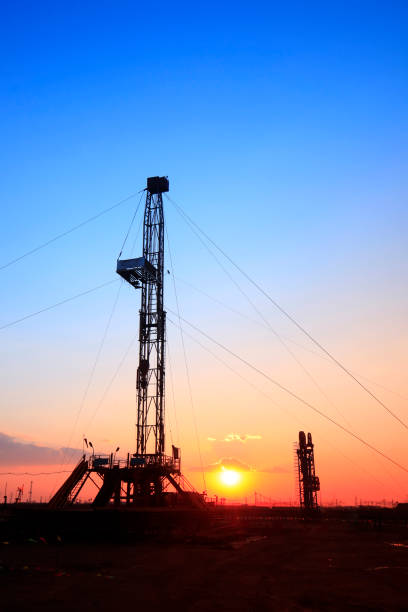 istock Oilfield derrick 695411570