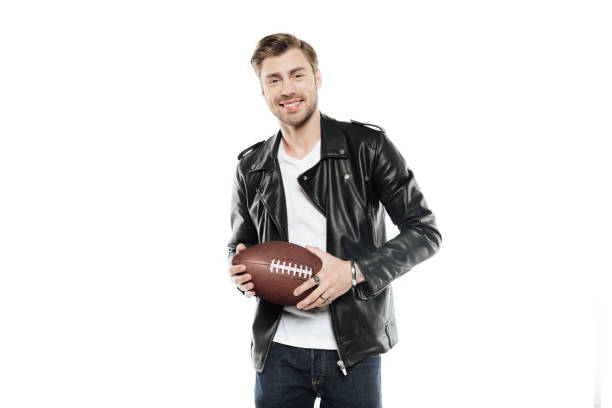 istock smiling man with rugby ball in hands looking at camera isolated on white 695411932