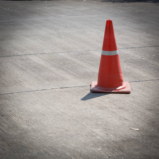 istock traffic cone on street used warning sign on road 695415414