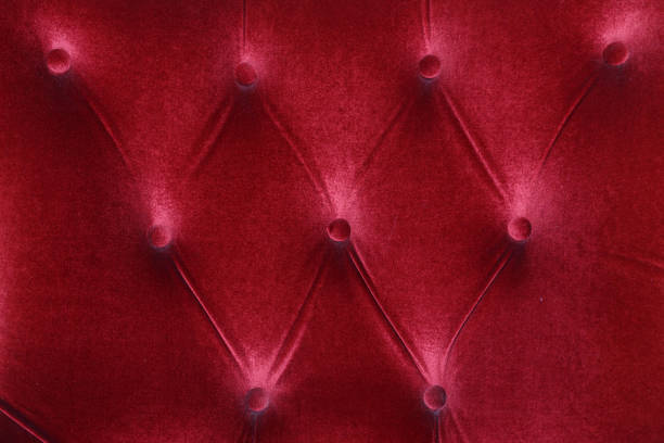 Pink Surface of the luxury buttons quilted leather sofa background elegant look. detail of material elegant interior