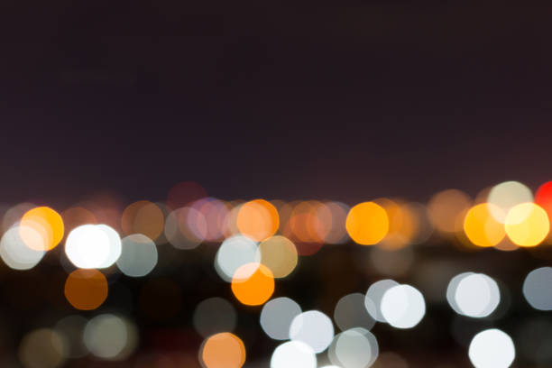 istock city night with dark sky, abstract blur bokeh light background 695419844