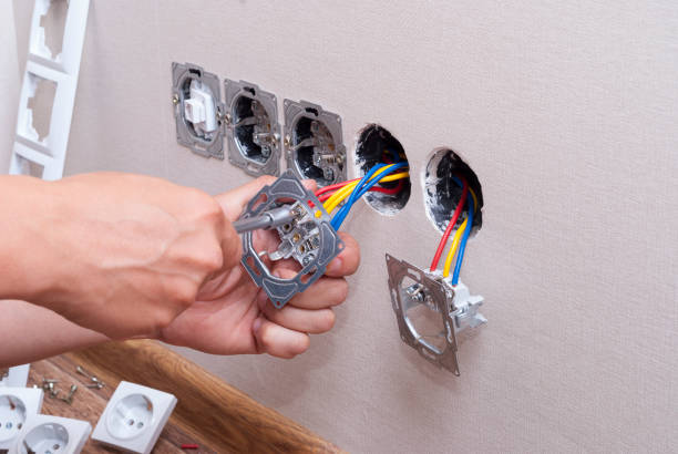 istock electrician connects the sockets 695420084