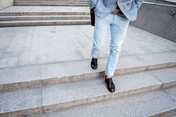 istock Busy stylish male person walking 695420720