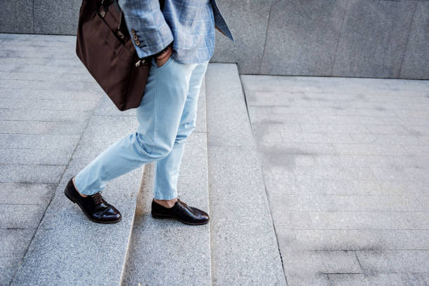 istock Busy male person having walk on steps 695420864