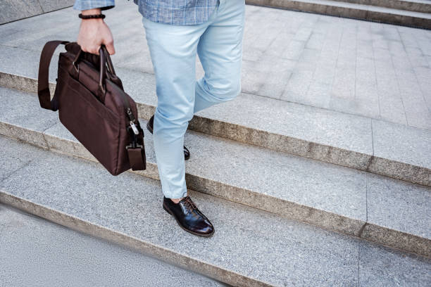 istock Gent male person keeping handbag 695425286