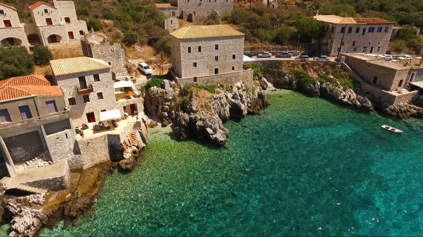 aerial drone photo of picturesque village of limeni in mani area with clear waters, peloponnese, lakonia, greece - mani peninsula imagens e fotografias de stock