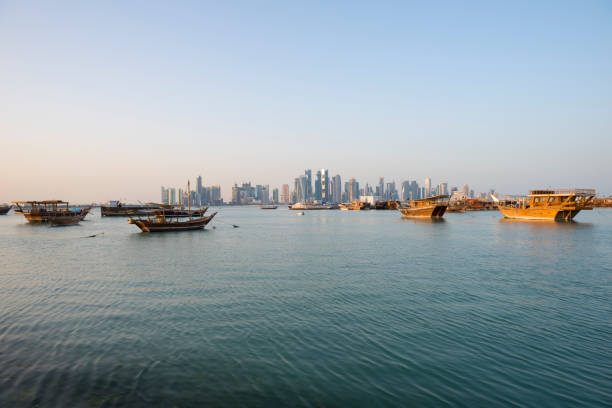 istock Dhows in Doha Bay and Doha skyline in Qatar 695434548
