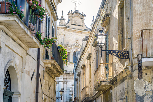 Charming street with lanterns of historic Lecce, Puglia, Itly