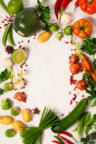 istock Frame of organic vegetables on white 695441604