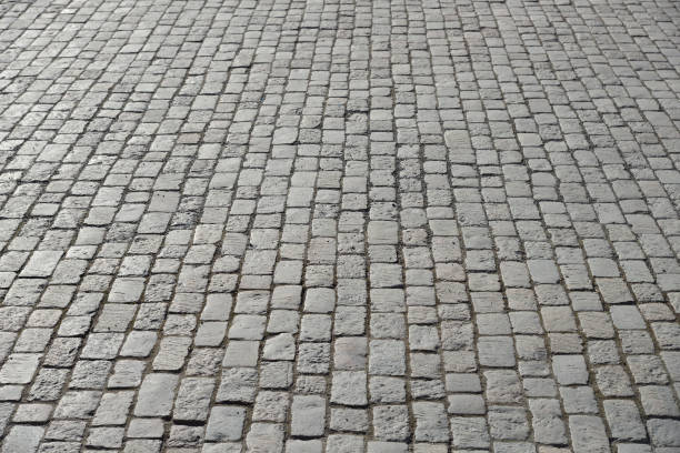 istock Abstract background of old cobblestone pavement 695446124