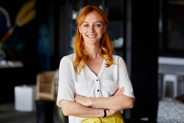istock Confident professional with arms crossed in office 695461240