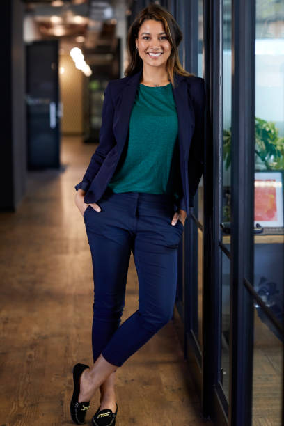 Young businesswoman with hands in pockets