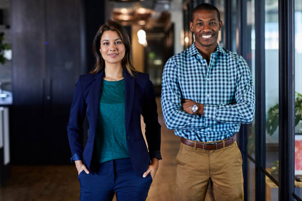 istock Multi-ethnic business people standing in office 695461600