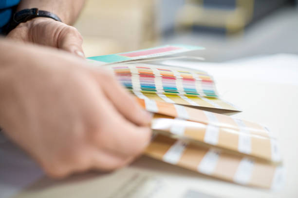 istock Graphic designer choosing colour for new project 695467254