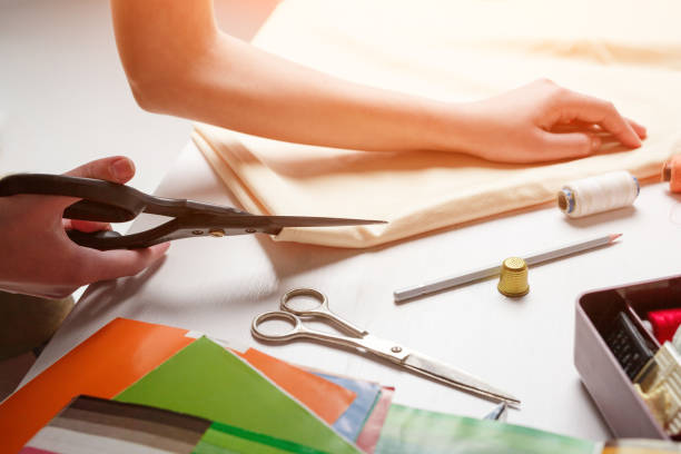 istock Crop woman cutting fabric 695470098